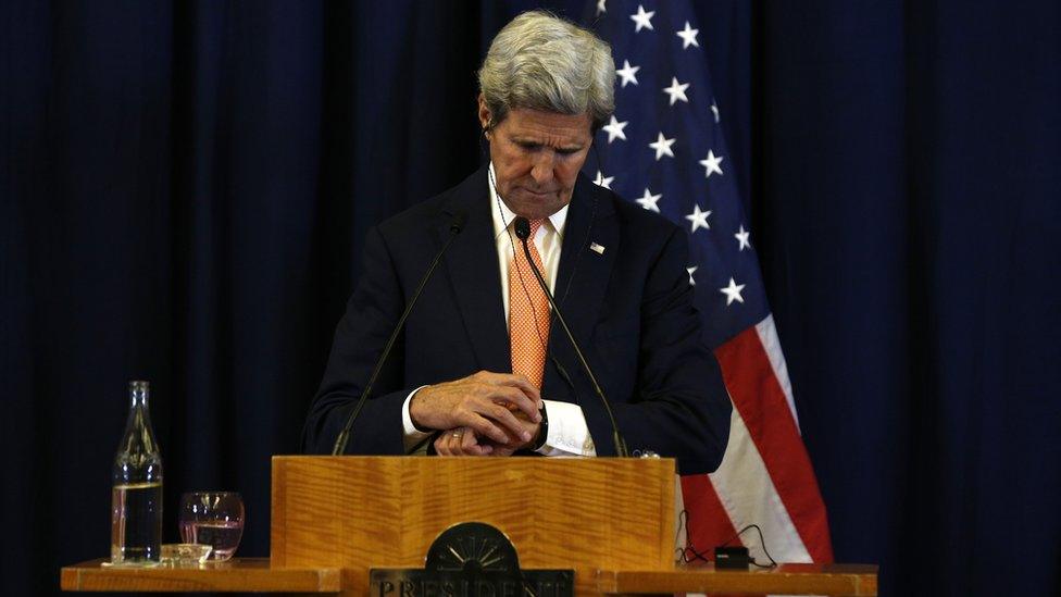 US Secretary of State John Kerry checks his watch during a press conference with Russian Foreign Minister Sergei Lavrov following their meeting in Geneva where they discussed the crisis in Syria on 9 September 2016.