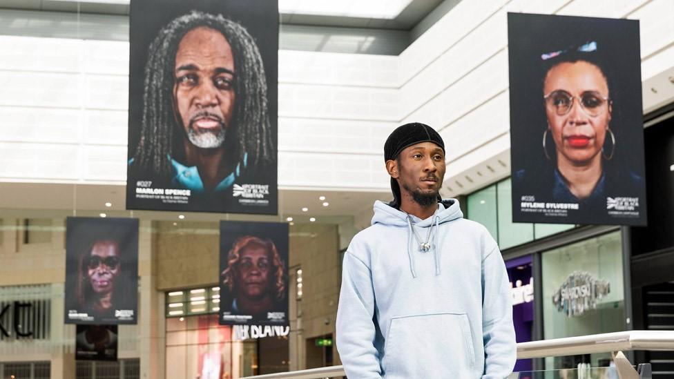 Cephas Williams with his exhibition Portrait of Black Britain