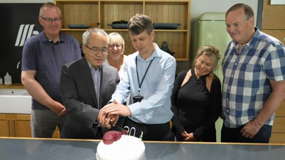 Kidney specialists cutting a cake