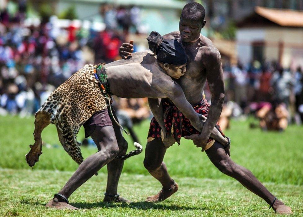 Two wrestlers from Terekeka and Jonglei compete in the final match of the South Sudan National Wrestling Competition at Juba Stadium, on April 23, 2016. After more than a 2 hours match, Jonglei was the winner. South Sudan is holding a wrestling for peace tournament, bringing together athletes from around the country. The last big tournament was canceled when civil war broke out in December 2013.