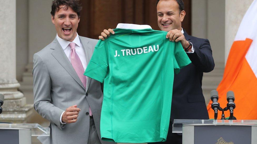 Leo Varadkar presents Justin Trudeau with a personalised Ireland rugby shirt.