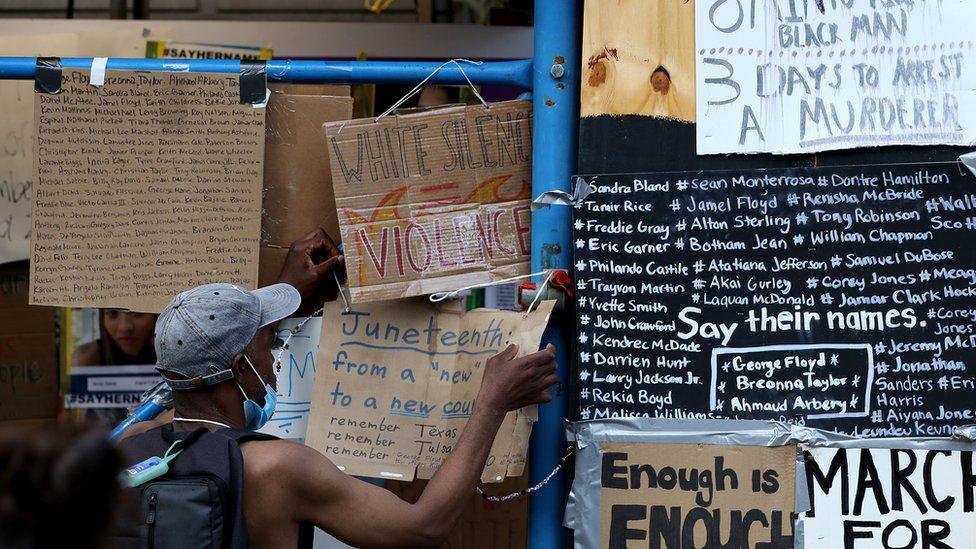 Protest signs on the streets of Minneapolis