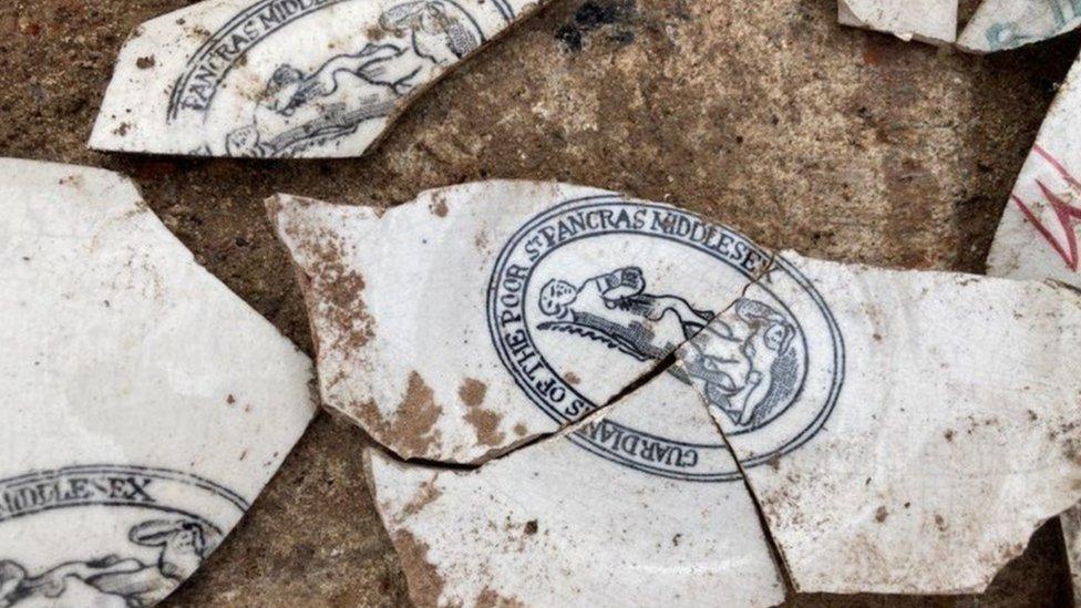 Image showing fragments of white pottery with branded blue and red decoration