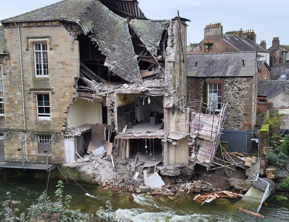 The damage to the rear of the building next to the river