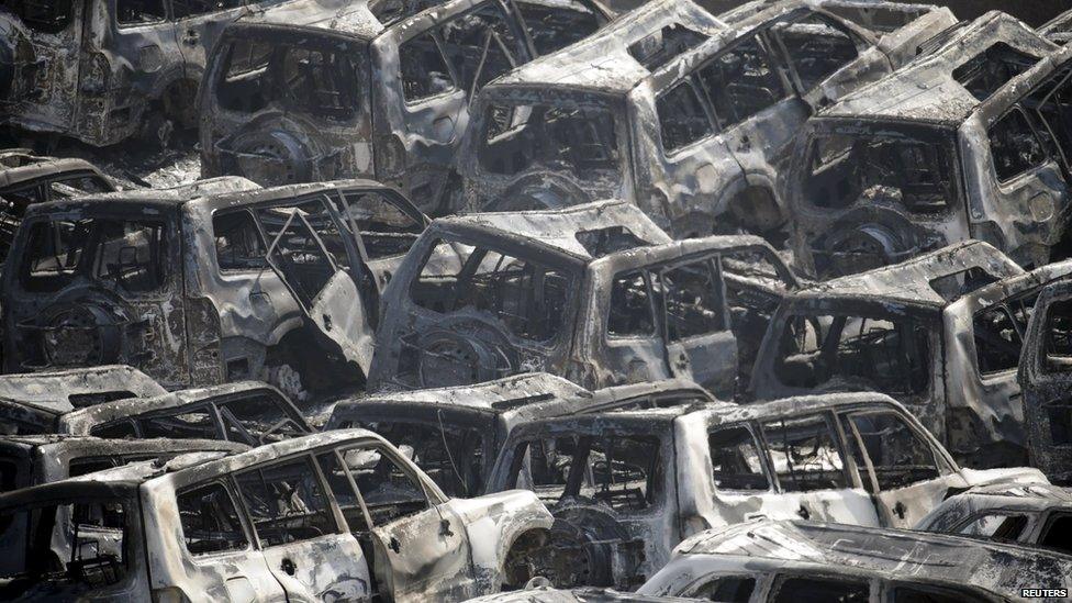 Burnt out cars in the aftermath of explosions at Tianjin