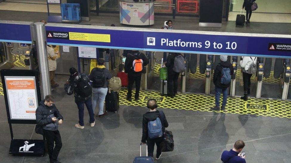 passengers-in-train-station.