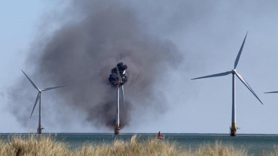 Smoke billowing from a wind turbine off the coast of Great Yarmouth