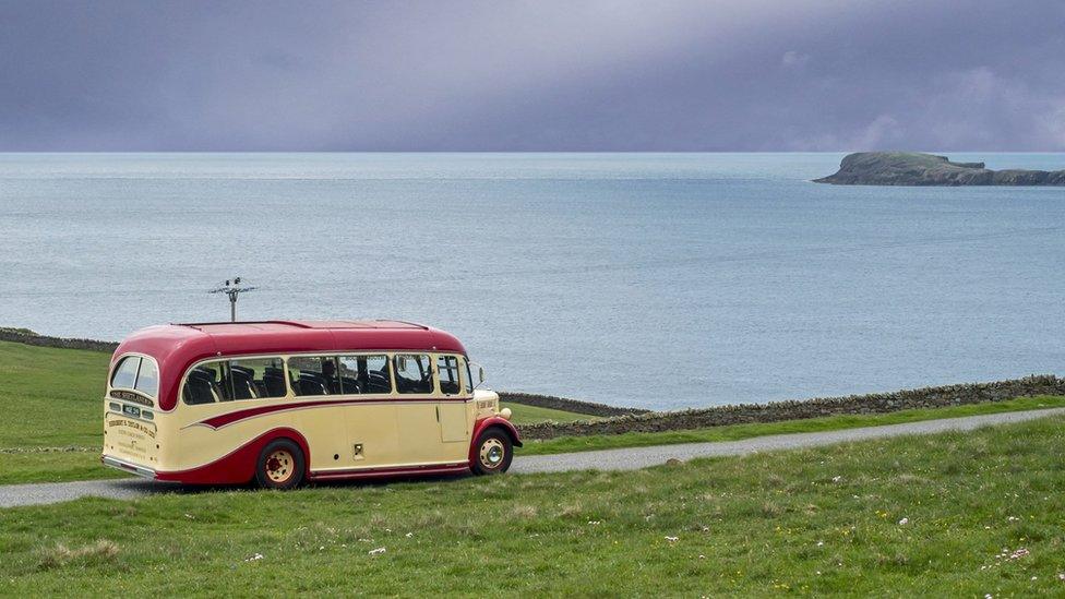 Coach on a coastal road