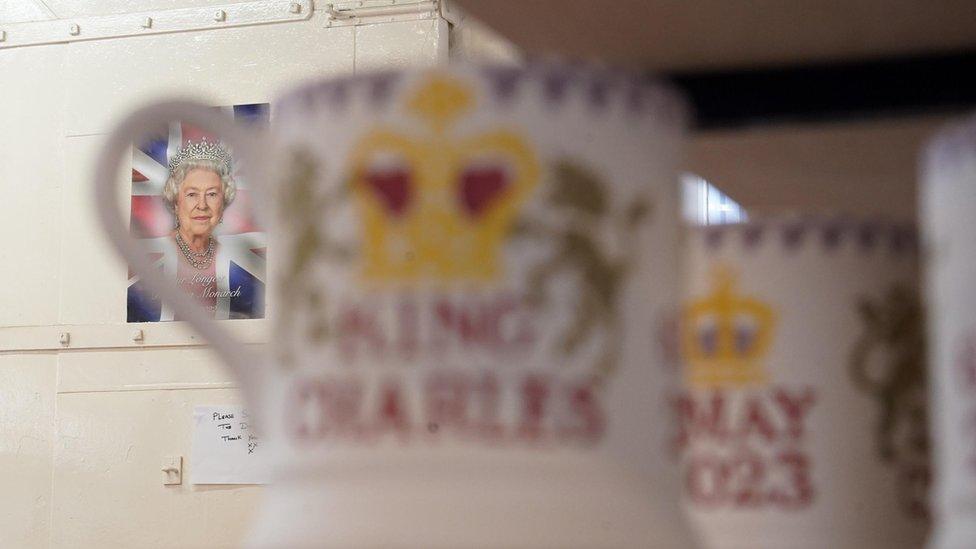 King Charles III themed mugs on display during the production of hand-decorated pieces from the forthcoming Coronation collection, at the Emma Bridgewater Pottery Factory in Stoke on Trent.