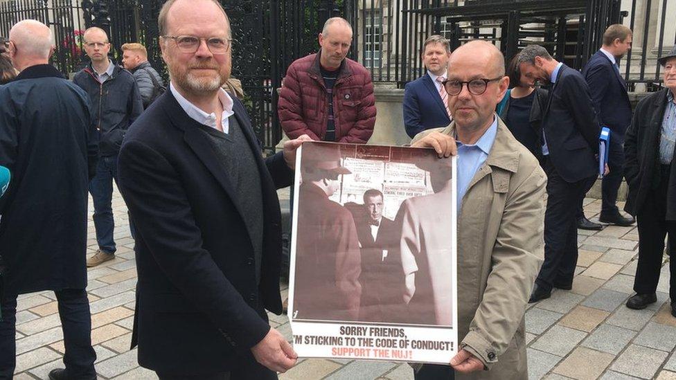 Trevor Birney and Barry McCaffrey with NUJ poster