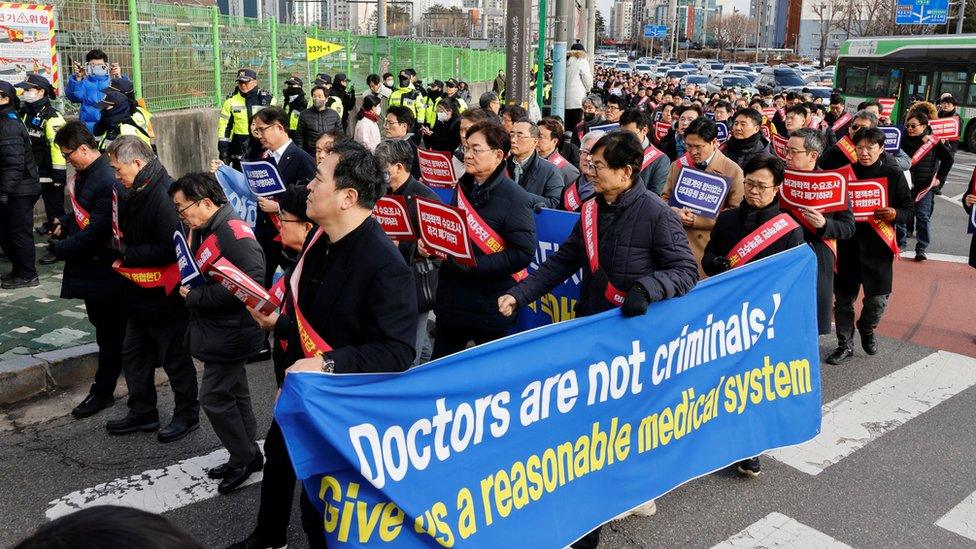 South Korean doctors march to protest against the government medical policy in front of the Presidential office in Seoul