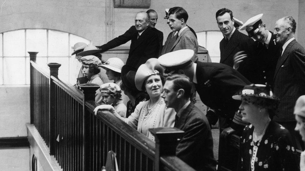 Princess Elizabeth (third from left), with King George VI and Queen Elizabeth during a visit to the chapel at the Royal Naval College, Dartmouth, 23 July 1939