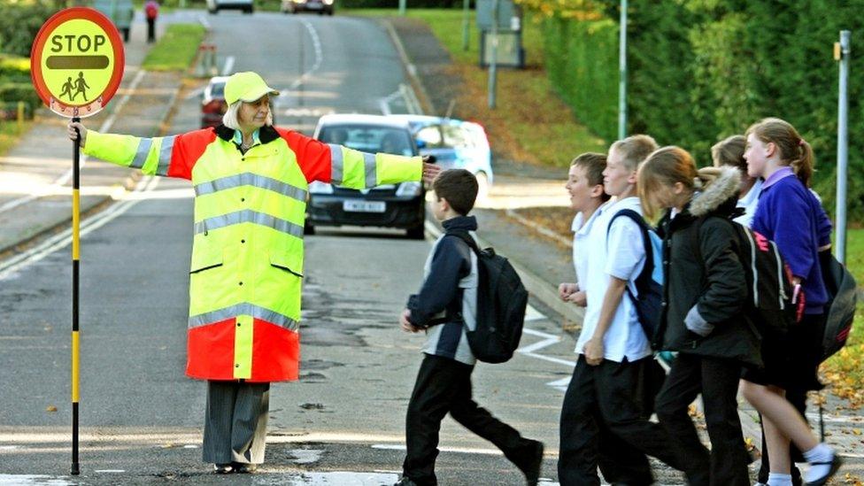 Lollipop lady and children