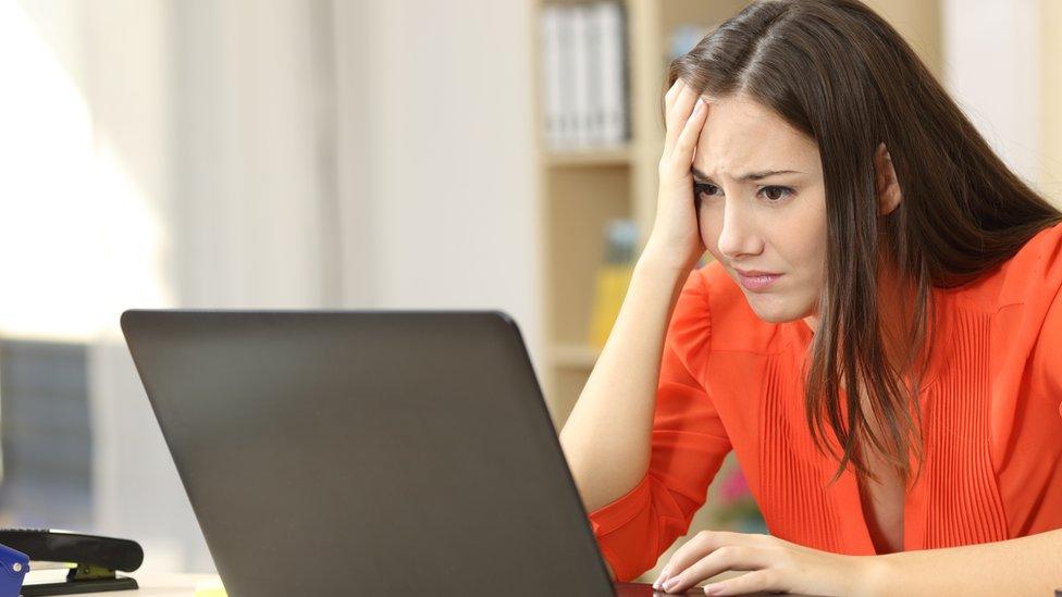 woman stressed at laptop