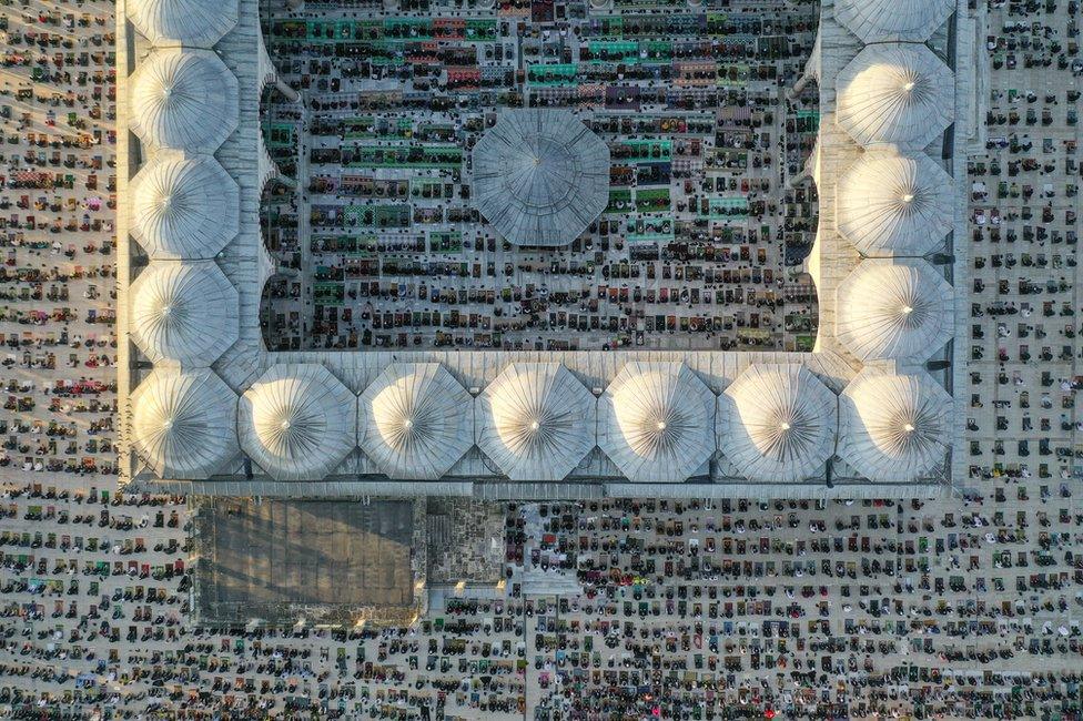 A drone photo shows an aerial view of the Fatih Mosque as hundreds of people gather to perform Eid al-Fitr prayer in Istanbul, Turkey