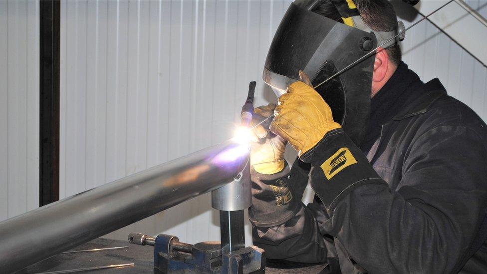 A goalpost being manufactured