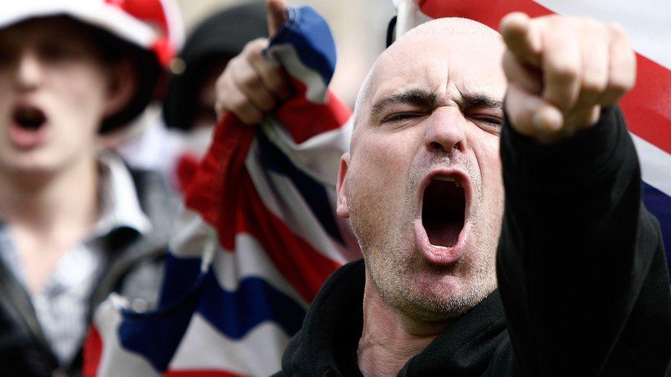 English Defence League supporters chant during a demonstration in the city centre on August 27, 2010 in Bradford, England.