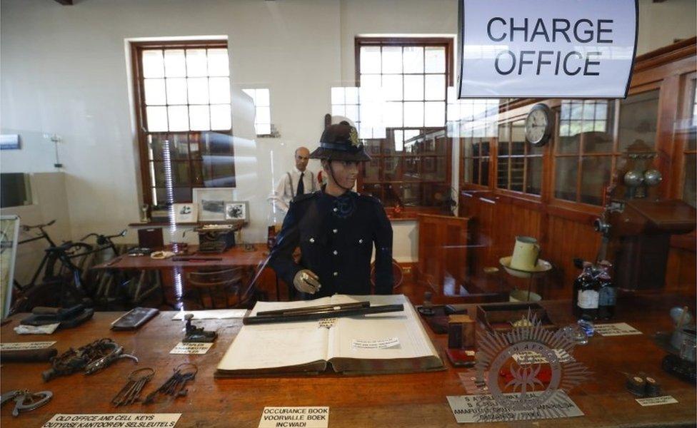 A 1913-1957 era charge office on exhibit at the South African Police Service"s (SAPS) Heritage Services Museum in Muizenberg, Cape Town, South Africa 09 November 2017. South Africa has one of the highest violent crime rates in the world with a very high rate of murders, assaults, rapes and other crimes.The South African Police Service"s has released the crime statistics for 2017 showing as many as 2,129,001 serious crimes were recorded in 2017 an increase from 2015/16. The SAPS Heritage Services Museum dating back to before 1874 portrais various era"s of South African policing and documents famous crimes whilst also giving the visitor a view into a prison cell, courtroom and charge office