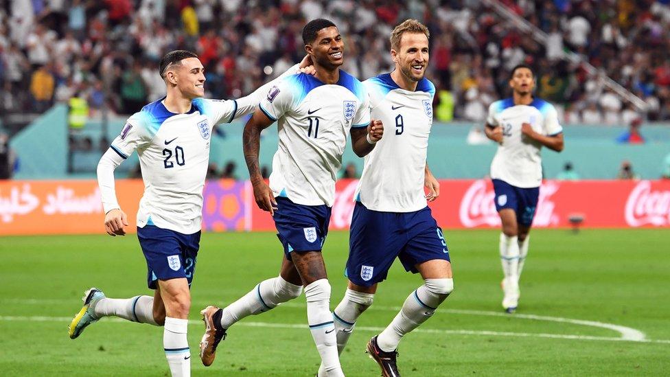 Marcus Rashford celebrates a goal with England teammates during the side's 6-2 win over Iran