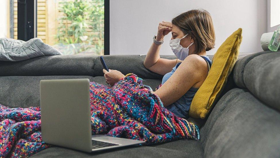 Sick woman on sofa