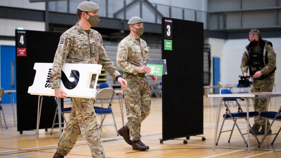 Members of the Royal Scots Dragoon Guard help set up a vaccination centre at the Ravenscraig Regional Sports Facility