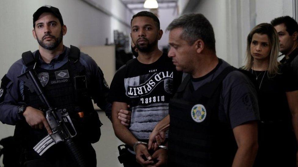 Rogerio Avelino da Silva, also known as Rogerio 157, who is accused by authorities to be the drug dealing chief of Rocinha slum, is escorted by policemen at a police station complex in Rio de Janeiro, Brazil December 6, 2017.