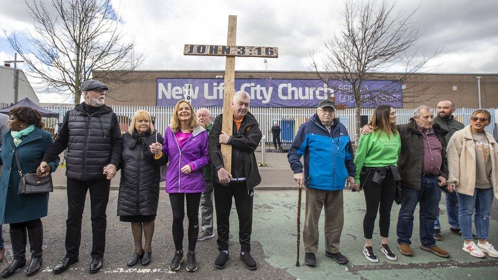 People in west Belfast form a "human peace wall" to mark the 25th anniversary of the Good Friday Agreement