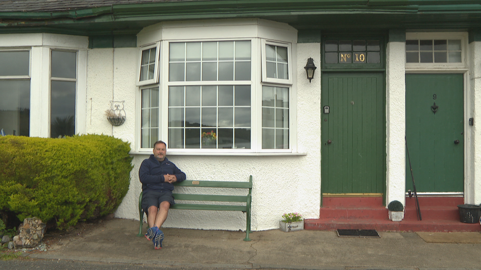 David Miller outside his holiday home