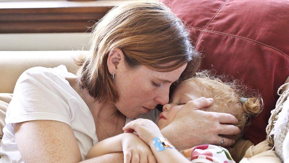 Girl hugging a child