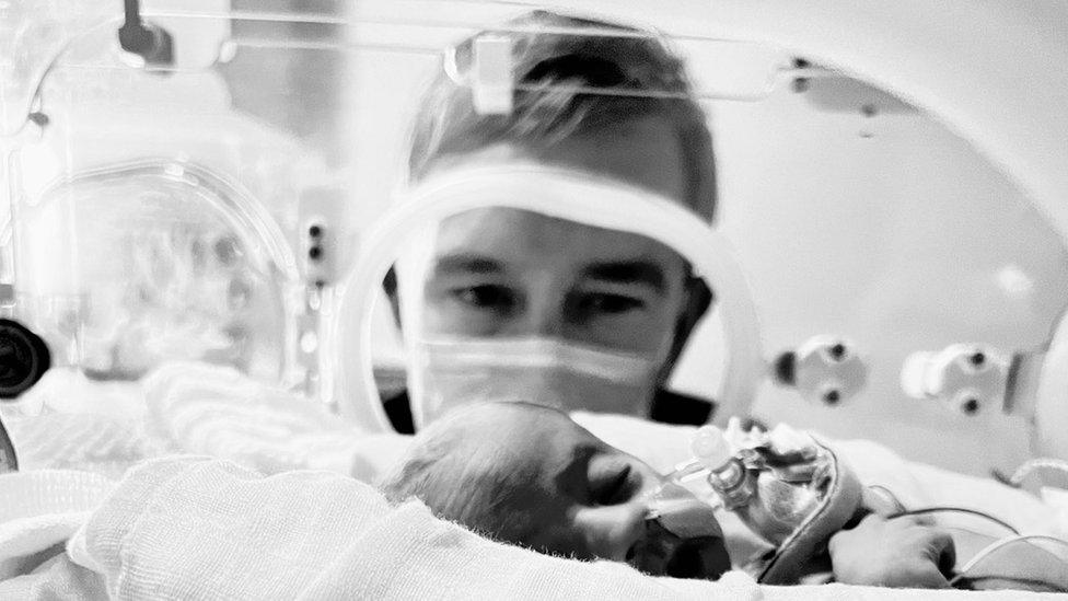 Simon Thomas and his premature daughter