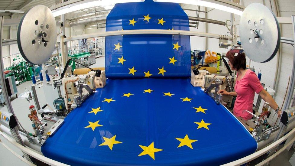 Worker at a flag-making factory in Germany