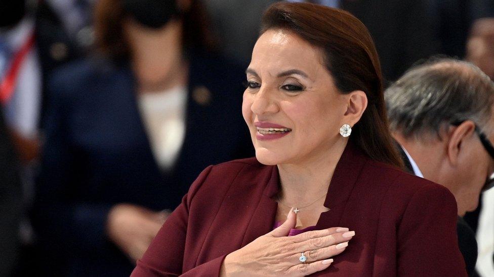 Honduran president-elect Xiomara Castro gestures after swearing in during her inauguration ceremony, in Tegucigalpa