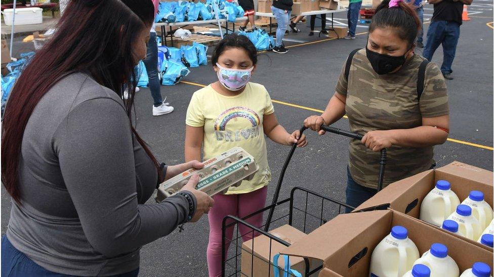 A family visiting an Orlando food bank in December