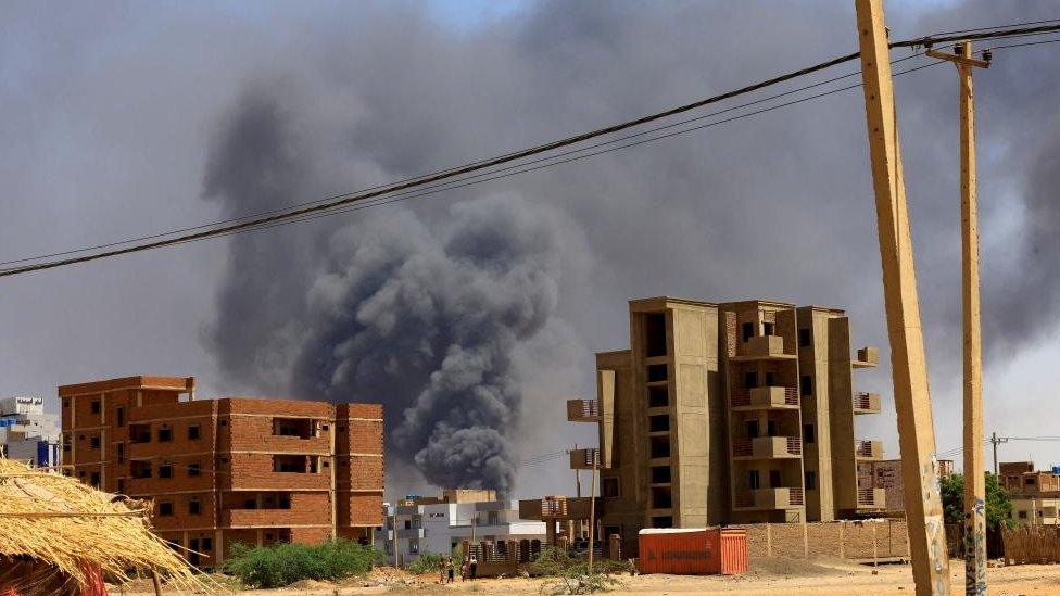 Smoke rises above a building