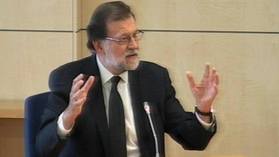 Spain's Prime Minister Mariano Rajoy is seen on a monitor of a live feed as he declares as a witness at Spain's High Court on 26 July 2017 in San Fernando de Henares, Spain