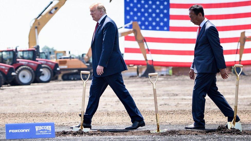 US President Donald Trump (L) and Foxconn Chairman Terry Gou leave after a groundbreaking for a Foxconn facility at the Wisconsin Valley Science and Technology Park June 28, 2018 in Mount Pleasant, Wisconsin