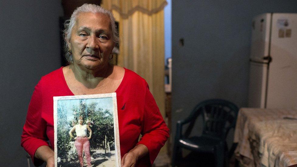 Edita Maldonado holds a picture of her late daughter Rosa