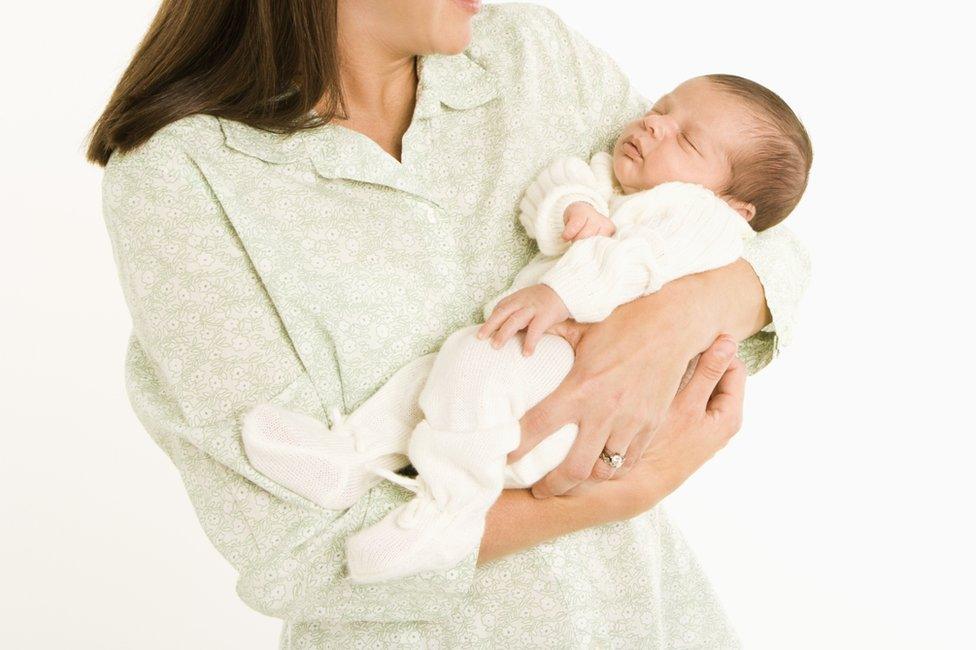 Woman holding baby