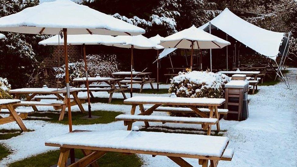 Snow on beer garden tables