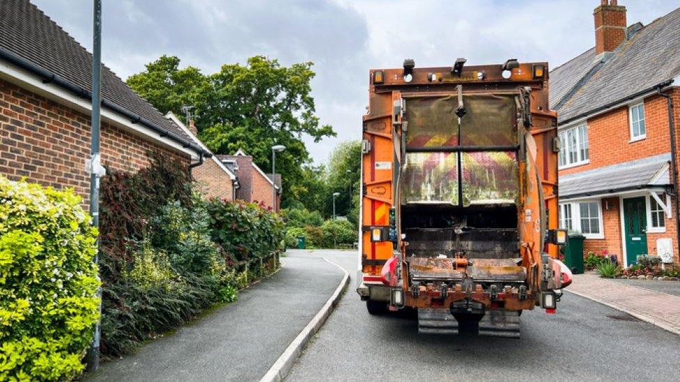 A bin lorry on a street