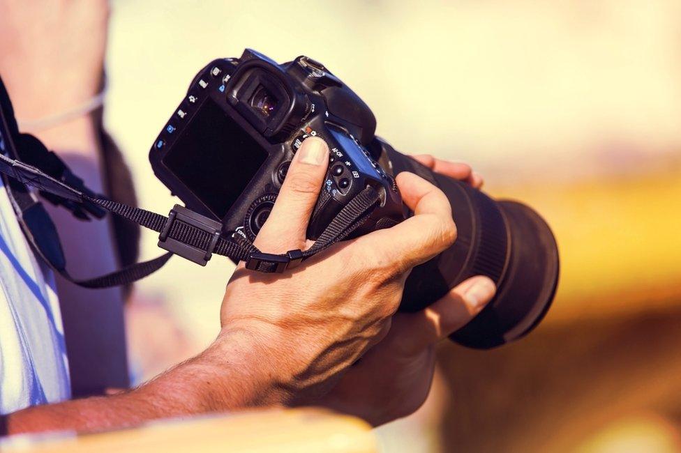 Man holding camera