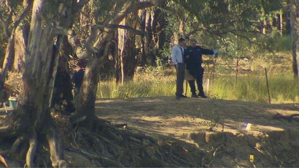 Police examine the Murray River on the Victoria-New South Wales border