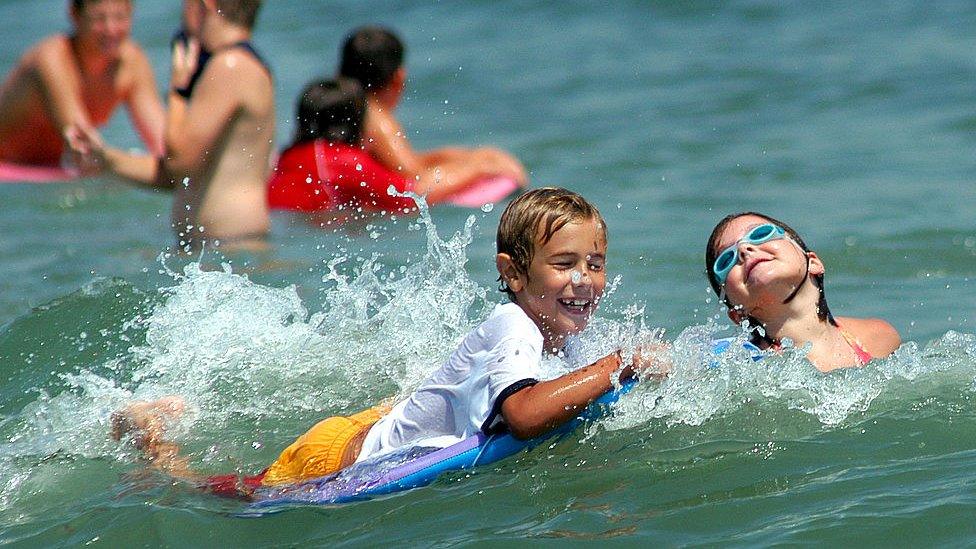 children playing in sea