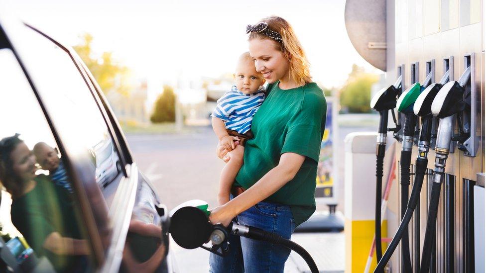 woman at petrol pump