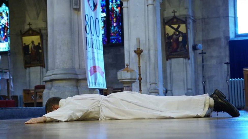 Brother Philip Mulryne lies prostrate at the ordination service in Dublin, 29 October 2016