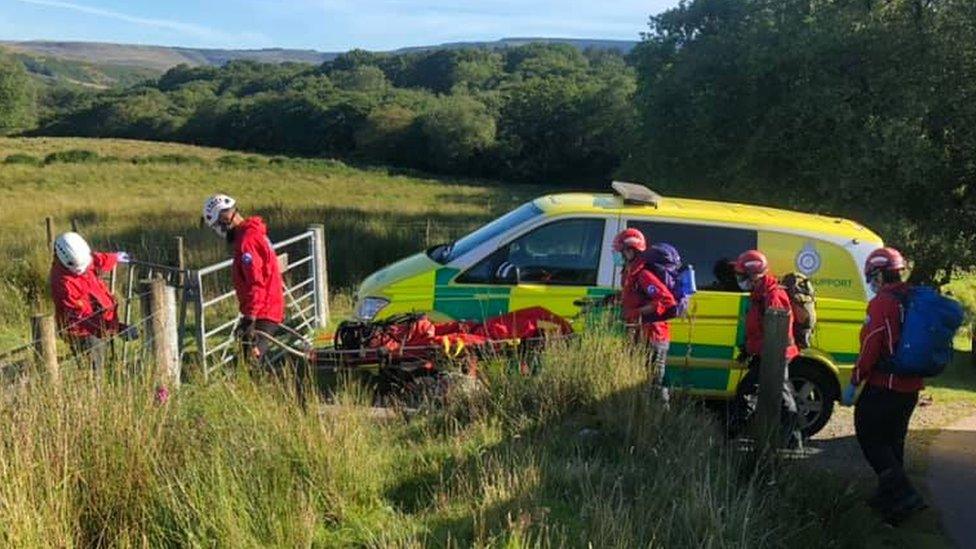 rescuers carrying stretcher