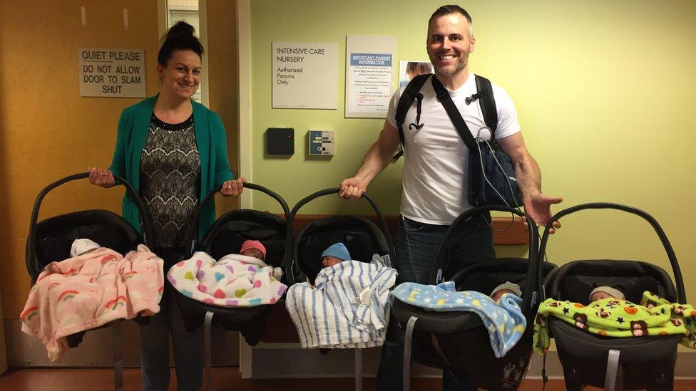 Amy and Chad Kempel with their quintuplets