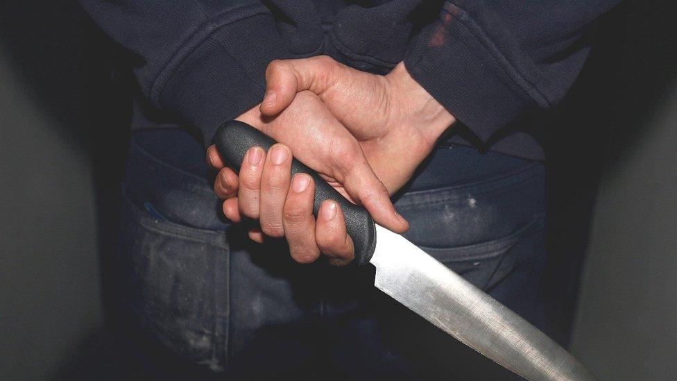 Teenager with knife in hand