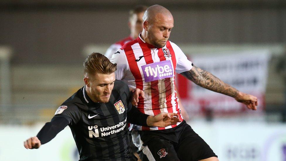 Nicky Law of Exeter City wearing shirt with Flybe logo