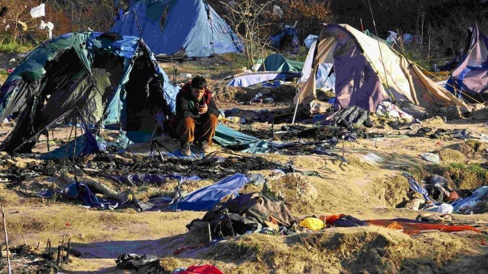 A migrant in the "Jungle" camp near Calais